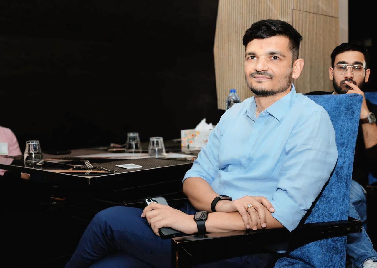 Priteesh Patel seated at a community gathering