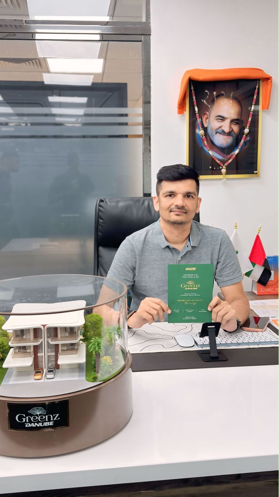 Priteesh Patel at a real estate office desk